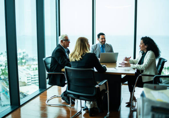 Coworkers talking on business meeting on office
